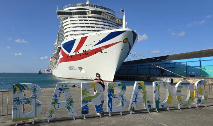 our owner stood in front of a cruise ship
