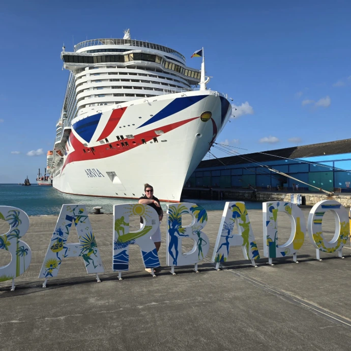 our owner stood in front of a cruise ship